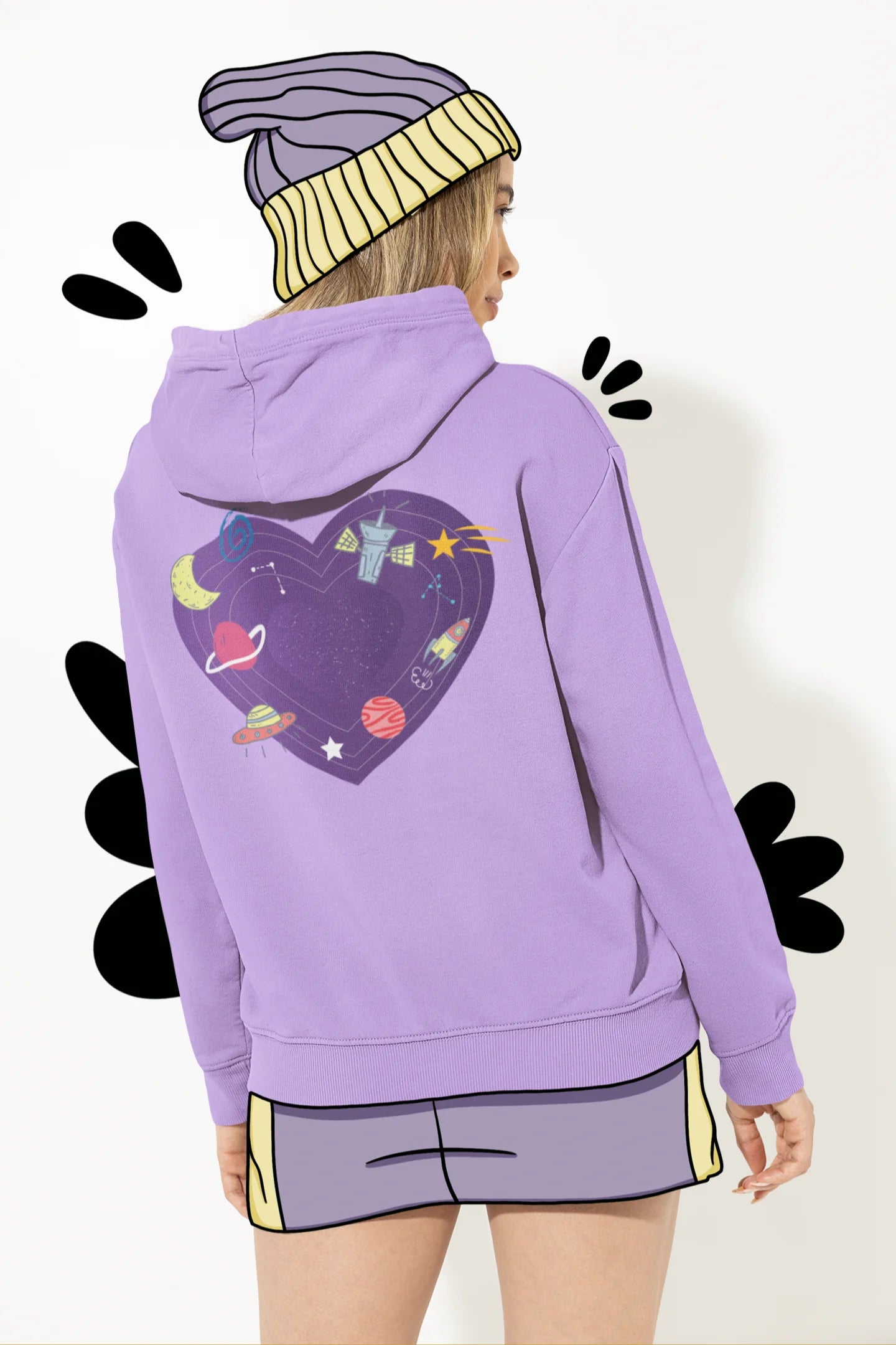 Back view of a female model wearing an lavender hoodie with the "Paradise" album artwork by Coldplay.