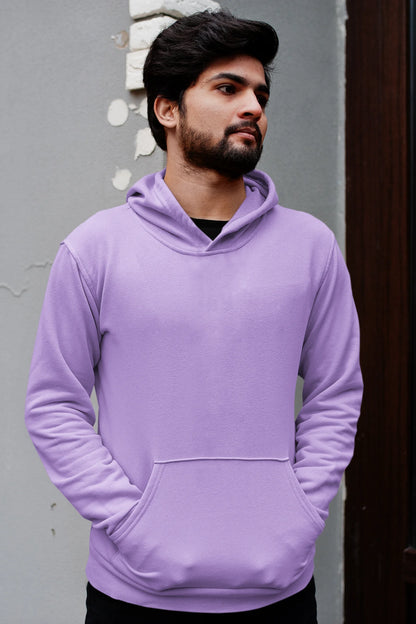 Third front view of a male model wearing a lavender hoodie with a design of a cat dressed as a samurai, standing against a backdrop of waves and a rising sun.
