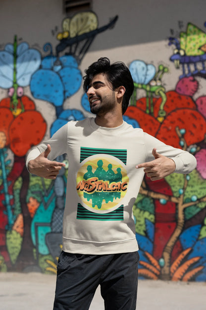 Third view of a male model wearing an oversized cream sweatshirt with a shadow silhouette of the Coldplay band members and the word "Nostalgic" printed on it.