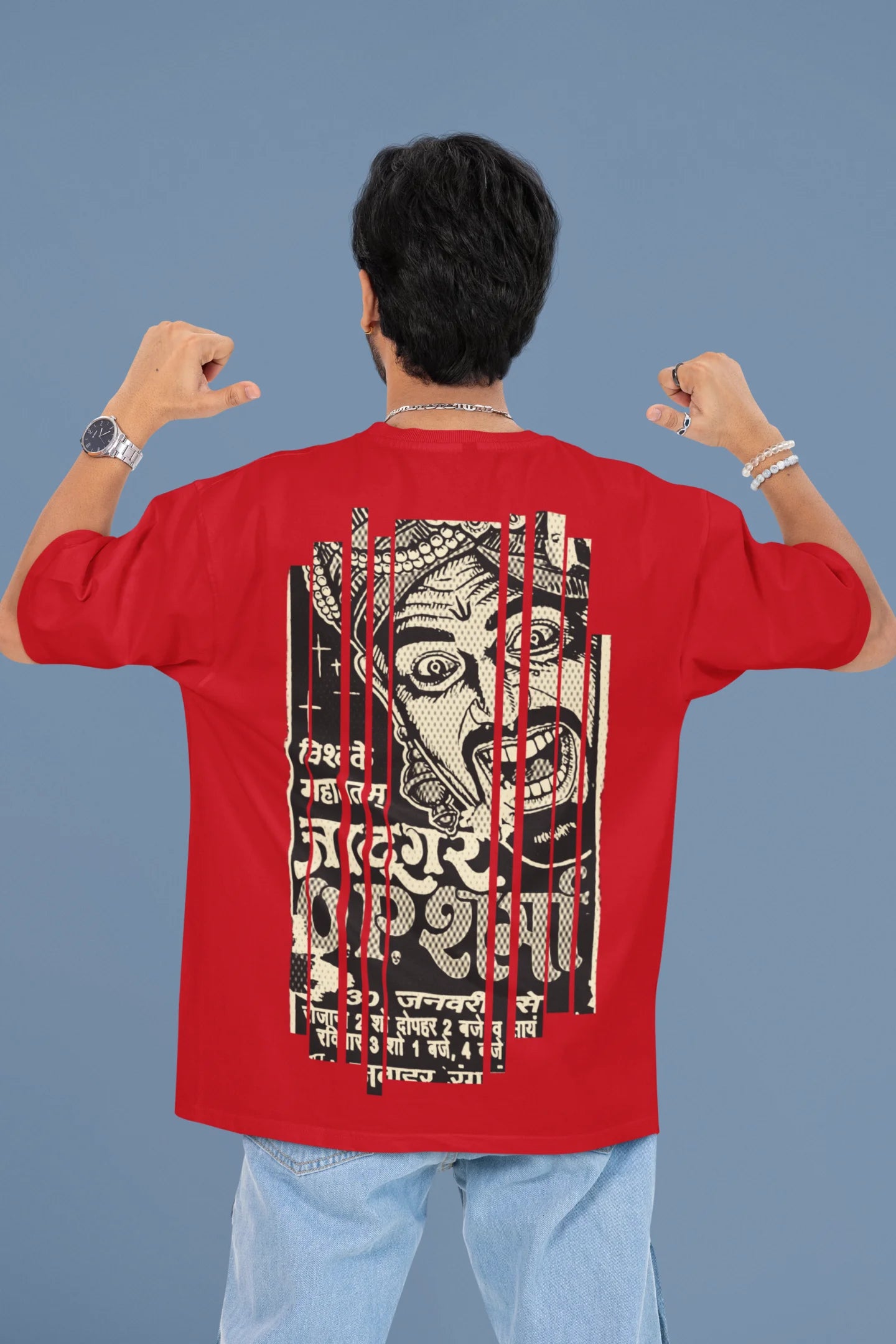 Back view of a male model wearing a red oversized t-shirt with a design referencing "Bachpan" (childhood) and featuring a recognizable element or silhouette associated with the Indian magician "O P Sharma."