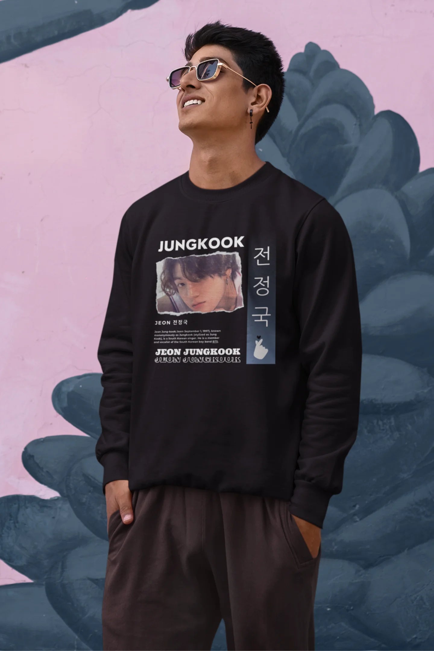 Second front view of a male model wearing a black sweatshirt featuring a vibrant design inspired by BTS member Jungkook. Ideal for fans of BTS and K-Pop music in general.