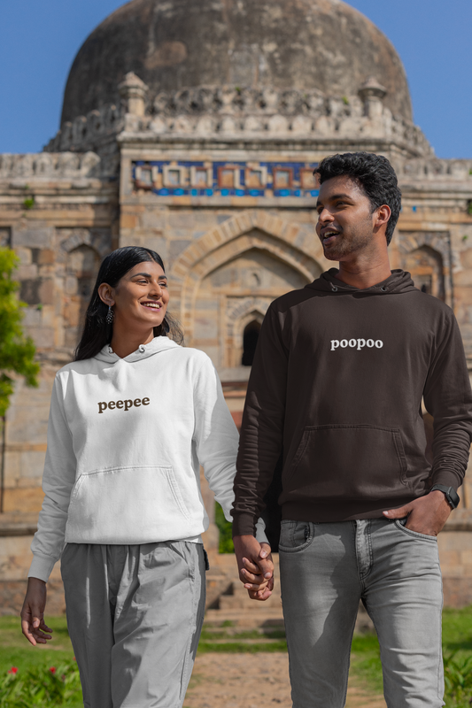 2nd front view of a couple wearing matching hoodies, one with the word "PeePee" and the other with the word "PooPoo".