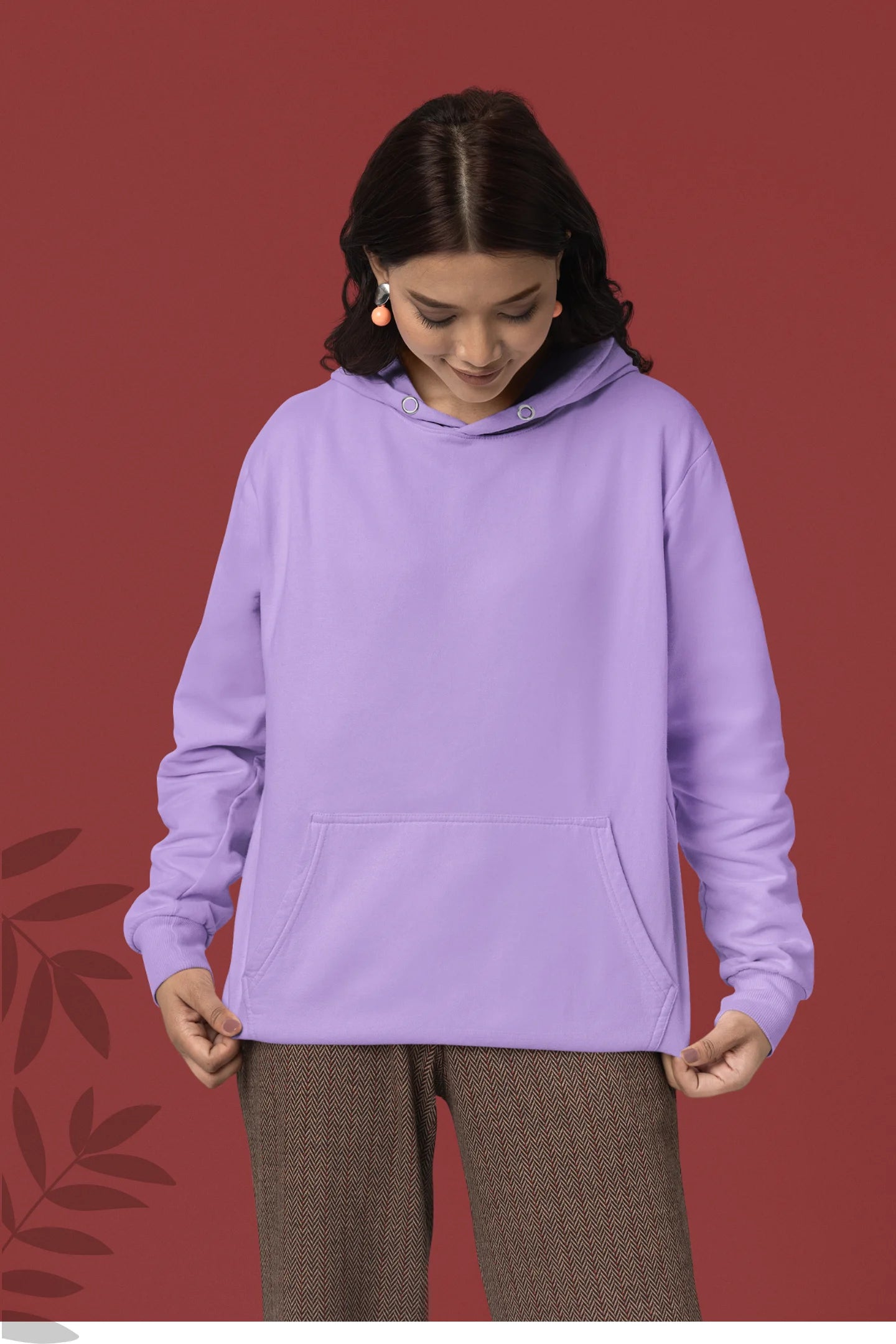 Second front view of female model wearing a lavender hoodie with a design of a cat dressed as a samurai, standing against a backdrop of waves and a rising sun.