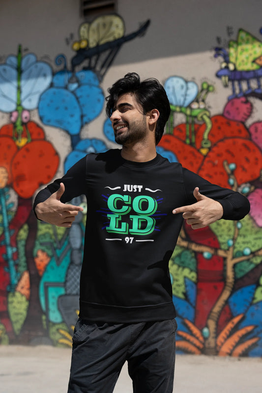 Second front view of a male model wearing an black sweatshirt with the text "Just Cold" printed on it.