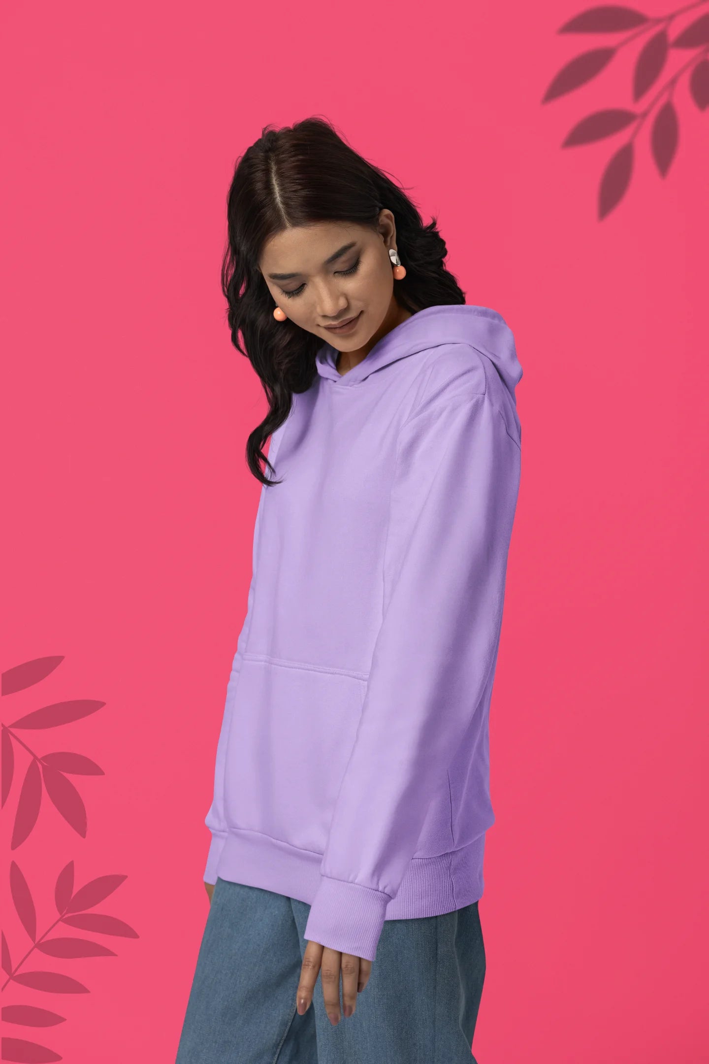 First front view of female model wearing a lavender hoodie with a design of a cat dressed as a samurai, standing against a backdrop of waves and a rising sun.