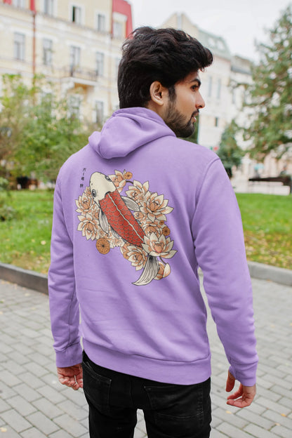 Back view of a male model wearing a lavender hoodie with a design of a koi fish swimming in a bed of flowers.