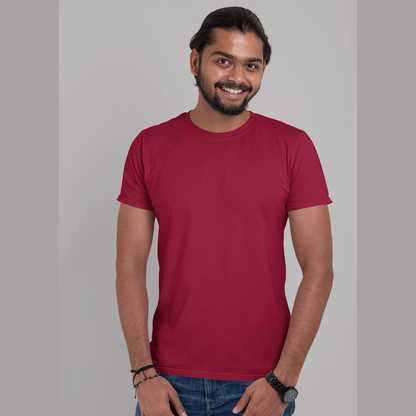 Front view of a male model wearing a maroon oversized, premium quality, pure cotton t-shirt.