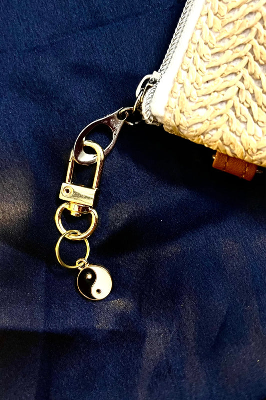 Fourth image of a couples yin and yang keychain symbolizing a balanced approach towards eternal love.