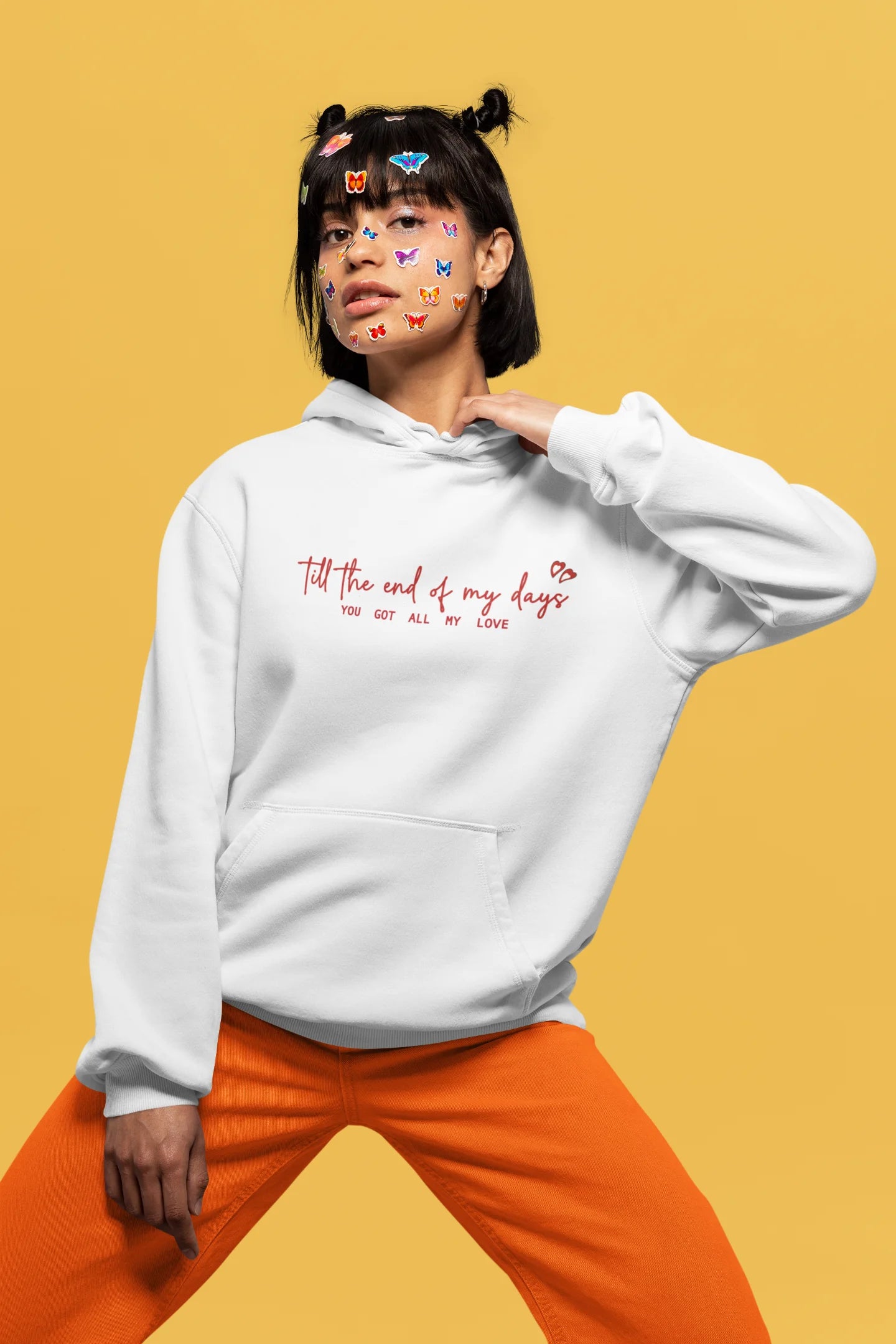 3rd front view of a female model wearing a off-white hoodie with a heart design and the text "All My Love".