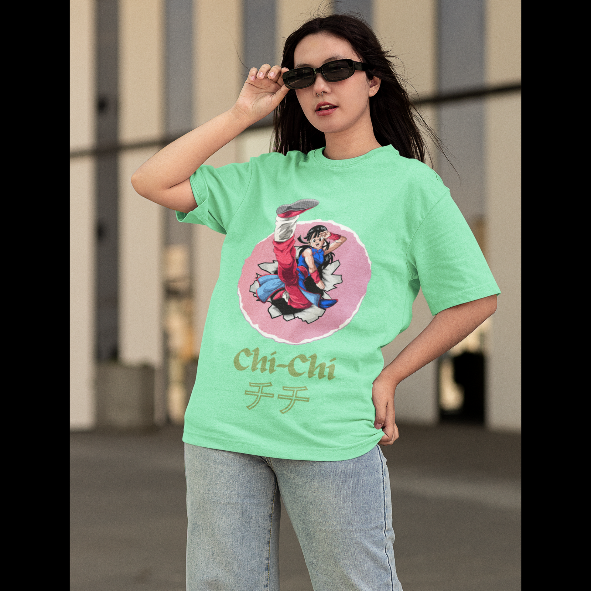2nd front view of a female model wearing a mint green oversized t-shirt featuring Chi-Chi from Dragon Ball Z with the text "Chi-Chi."