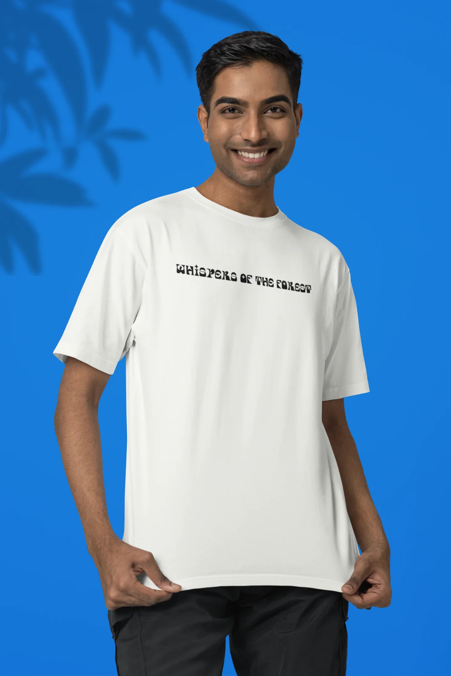 2nd front view of a male model wearing a off-white oversized tee with a design featuring three different types of butterflies, symbolizing the beauty and diversity of nature.