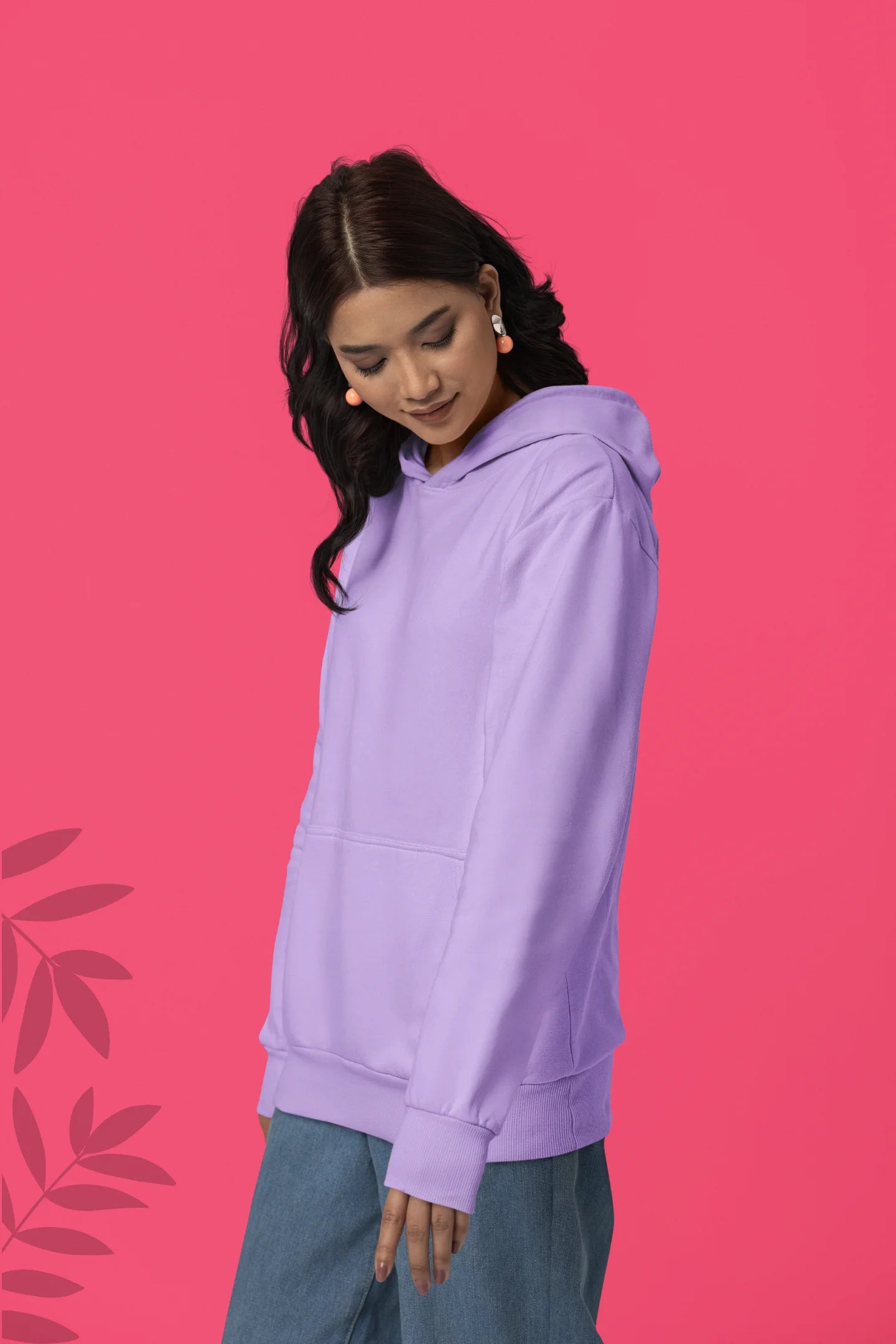 First front view of a female model wearing a lavender hoodie with a design of a koi fish swimming in a bed of flowers.