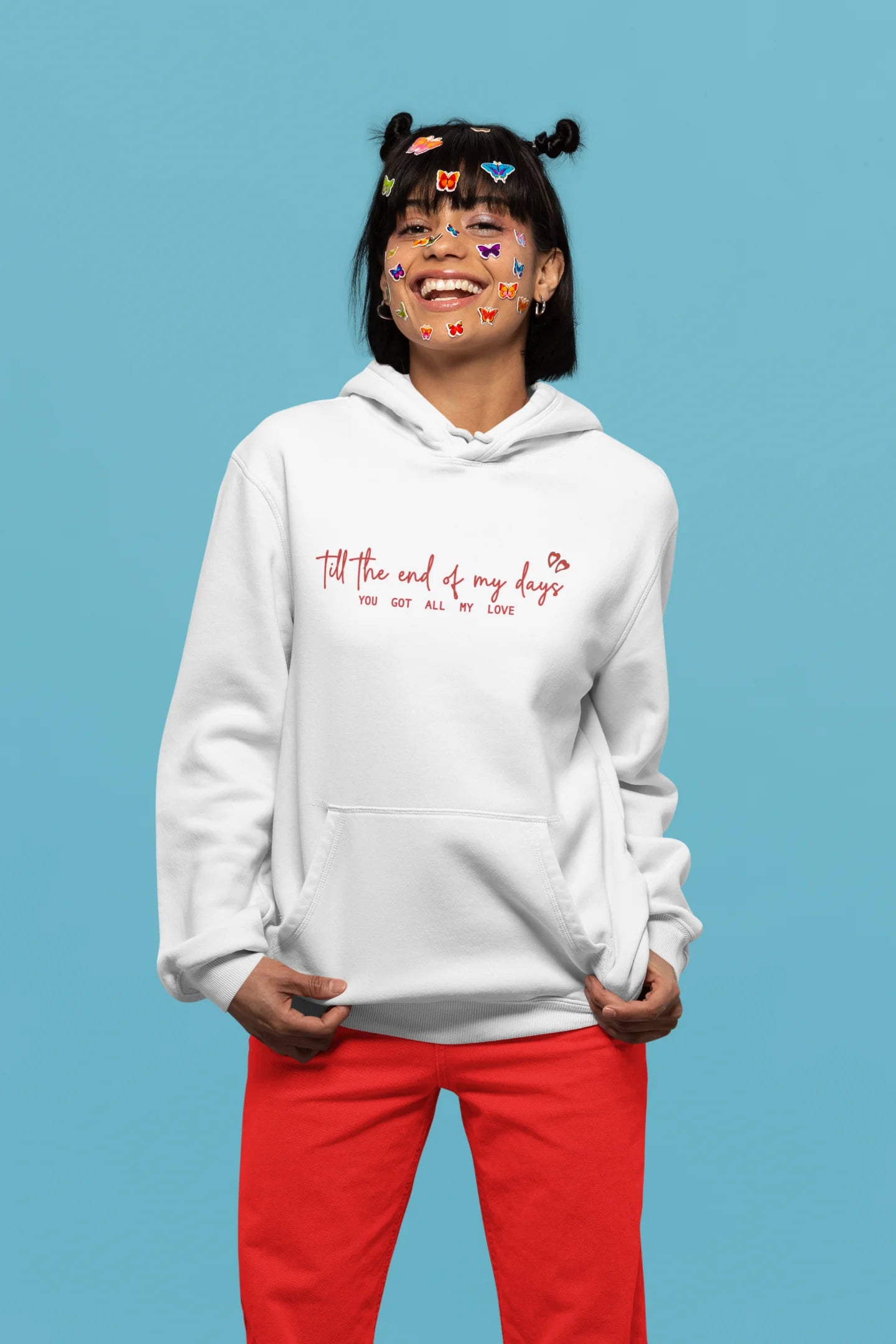 5th front view of a female model wearing a off-white hoodie with a heart design and the text "All My Love".