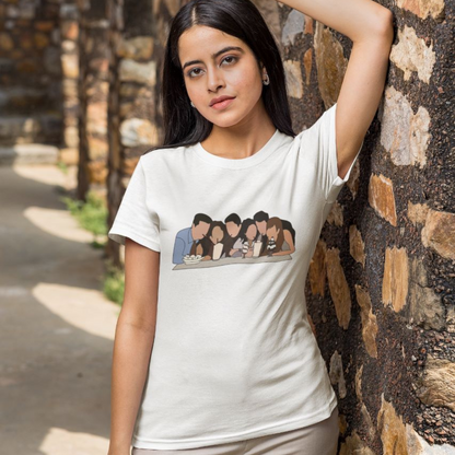 Front view of a female model wearing a white casual tee with Friends TV show inspired design featuring the central perk crew.
