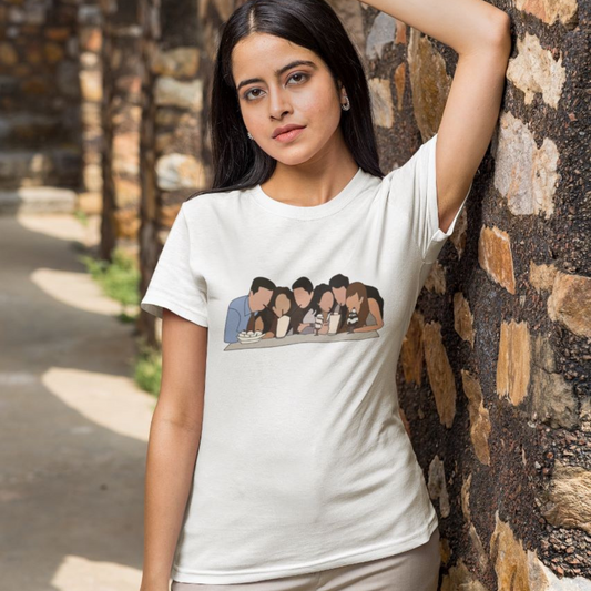 Front view of a female model wearing a white casual tee with Friends TV show inspired design featuring the central perk crew.