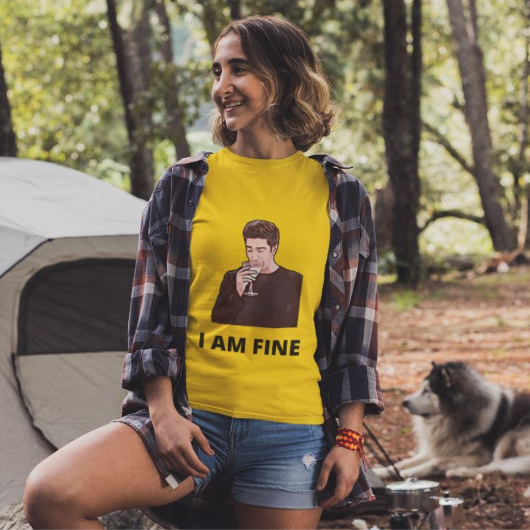 Front view of female model wearing a yellow casual t-shirt with F.R.I.E.N.D.S series inspired designs, embodying Ross's famous catchphrase 'I Am Fine'