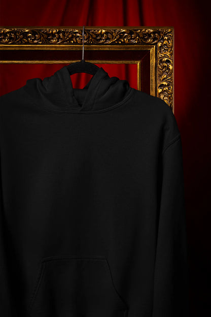 Front view of a black hoodie with a design of a wildcat sitting on ocean waves.