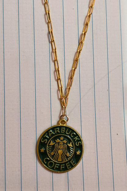 3rd view of a gold chain necklace with a small pendant featuring the Starbucks logo.