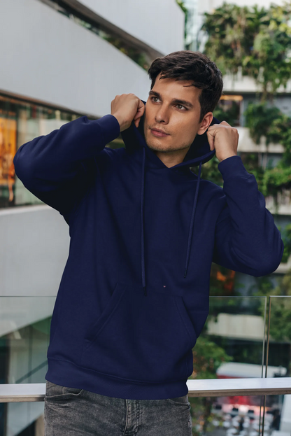 Front view of a male model wearing a navy blue premium quality, pure cotton hoodie.