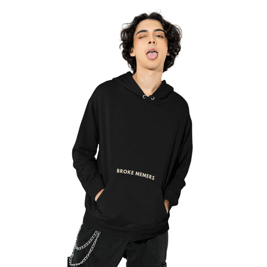 Front view of a male model wearing a black hoodie with a Disney design featuring a muscular duck and the text "The Honk."