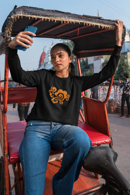 6th front view of a female model wearing a black sweatshirt featuring "Bindass" in a stylish Hindi font.