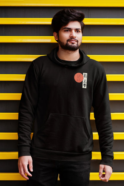 Second front view of a male model wearing a black hoodie with a design of a wolf surveying a Japanese landscape.