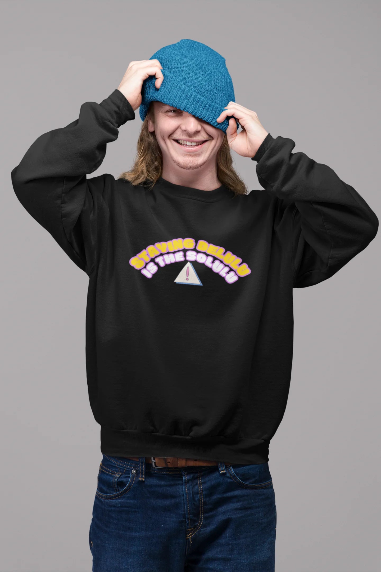 2nd front view of male model wearing a black sweatshirt with the hilarious message "Stay Delulu" in a bold design. Ideal for those who love trendy slang and lighthearted humor.