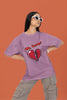 2nd front view of a female model wearing a dirty purple oversized t-shirt with the text 