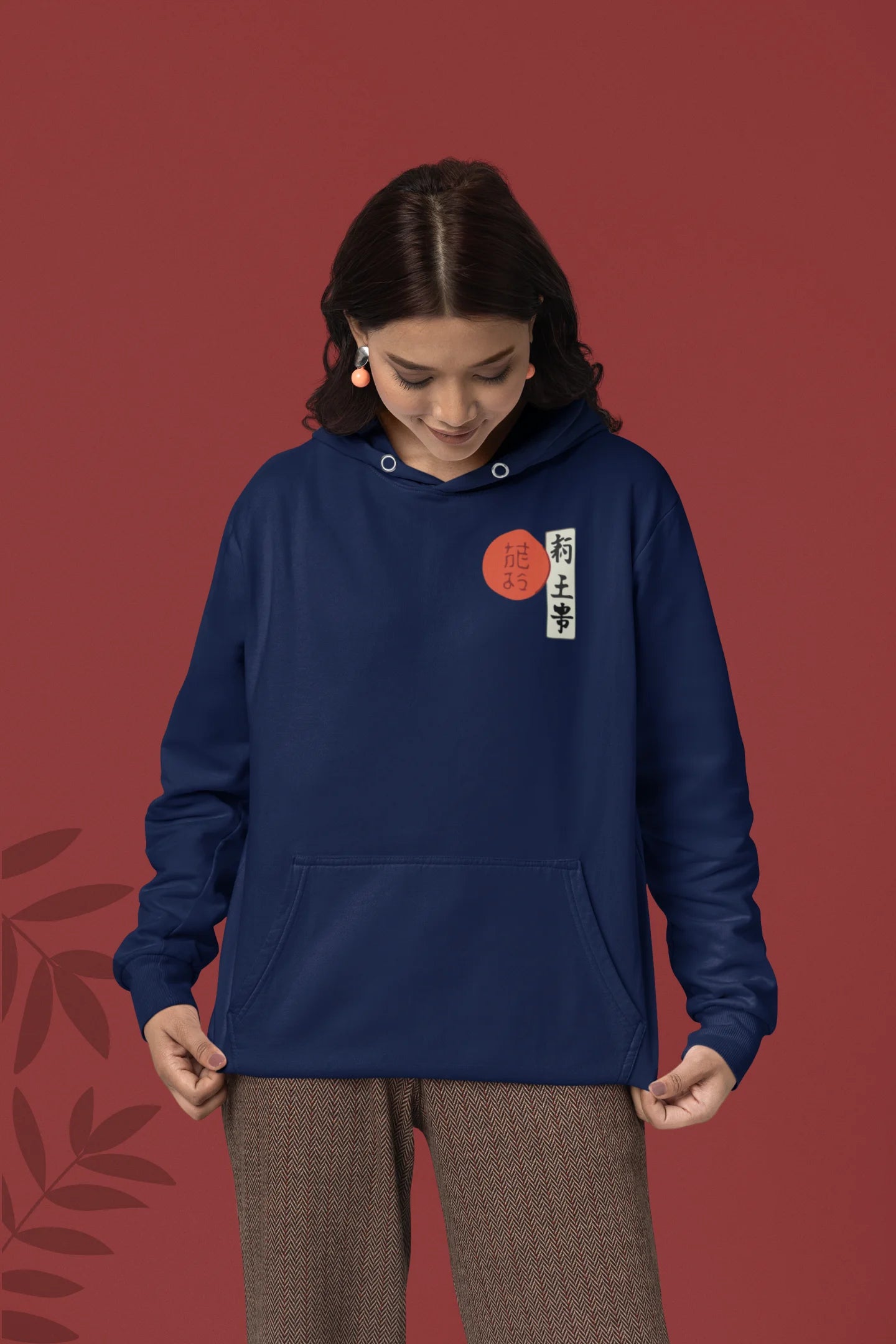 First front view of a female model wearing a navy blue hoodie with a design of a wolf surveying a Japanese landscape.