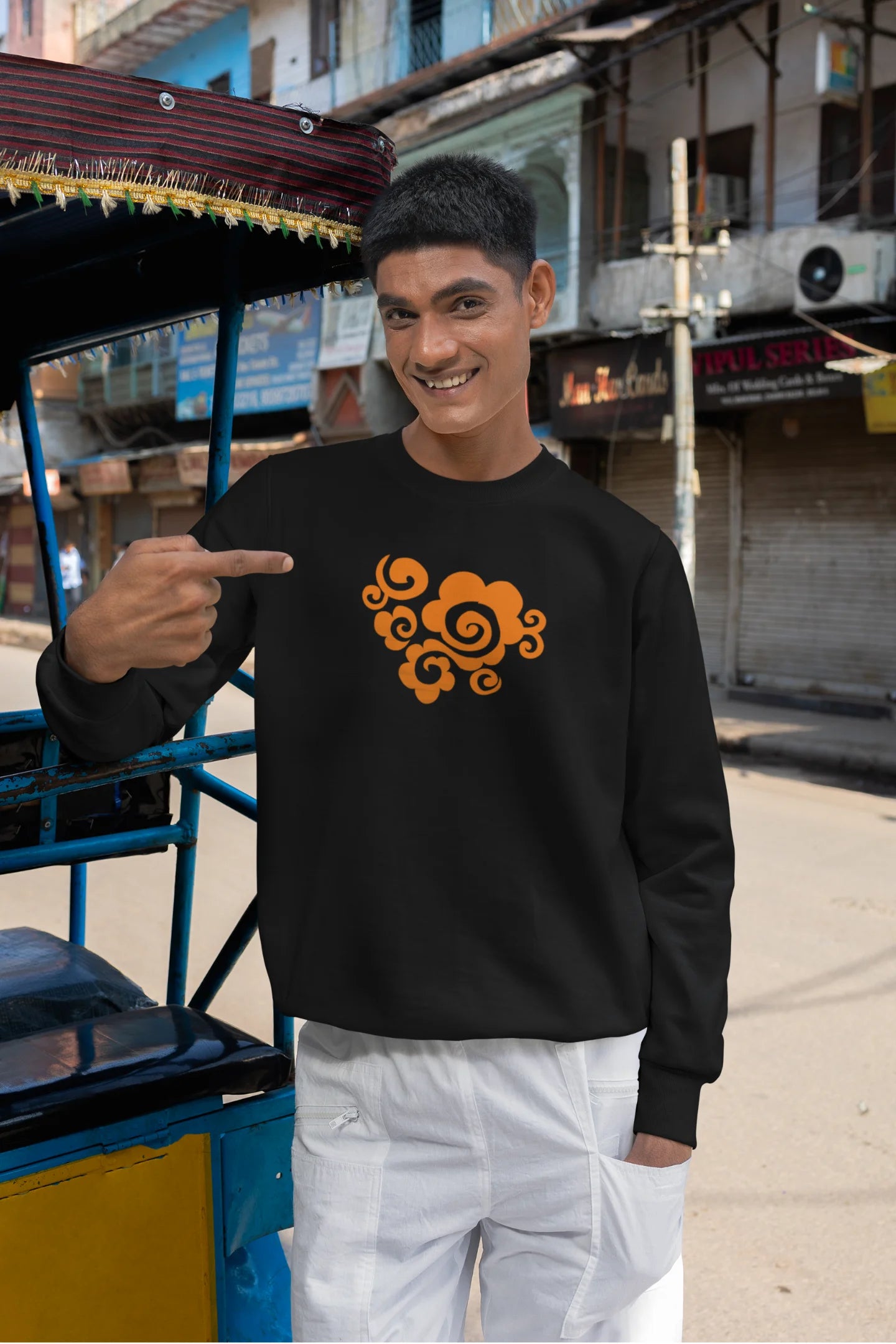 First front view of a male model wearing a black sweatshirt featuring "Bindass" in a stylish Hindi font.