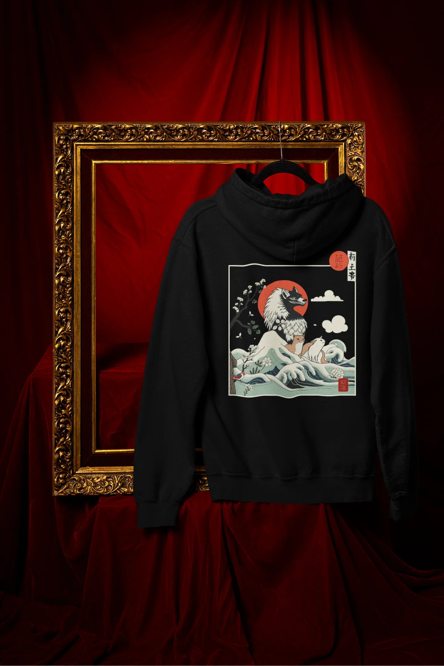 Back view of a black hoodie with a design of a wolf surveying a Japanese landscape.
