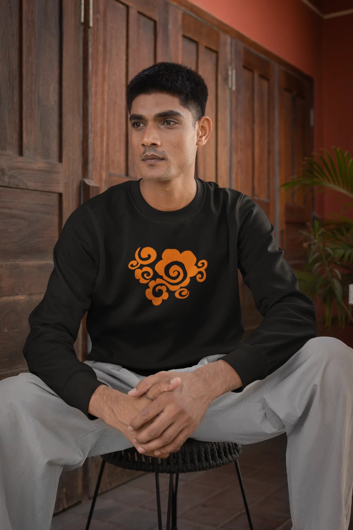 4th front view of a male model wearing a black sweatshirt featuring "Bindass" in a stylish Hindi font.