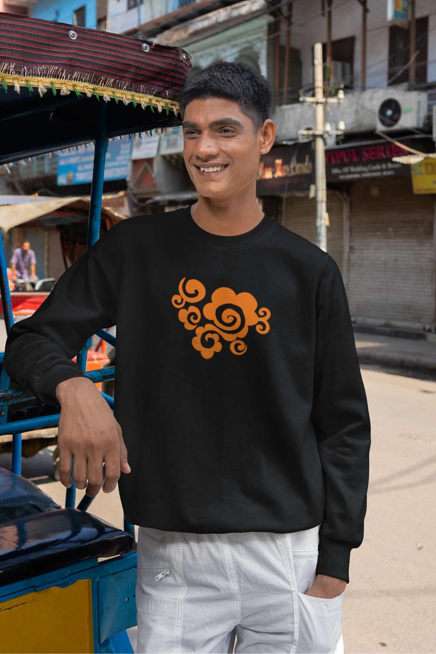 5th front view of a male model wearing a black sweatshirt featuring "Bindass" in a stylish Hindi font.