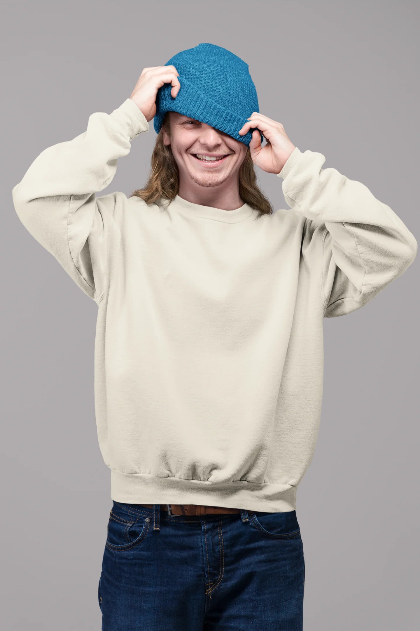 2nd front view of male model wearing an cream sweatshirt featuring a thought-provoking design of a golden lock shaped like an insect. Ideal for those who love symbolic clothing and unique conversation starters.