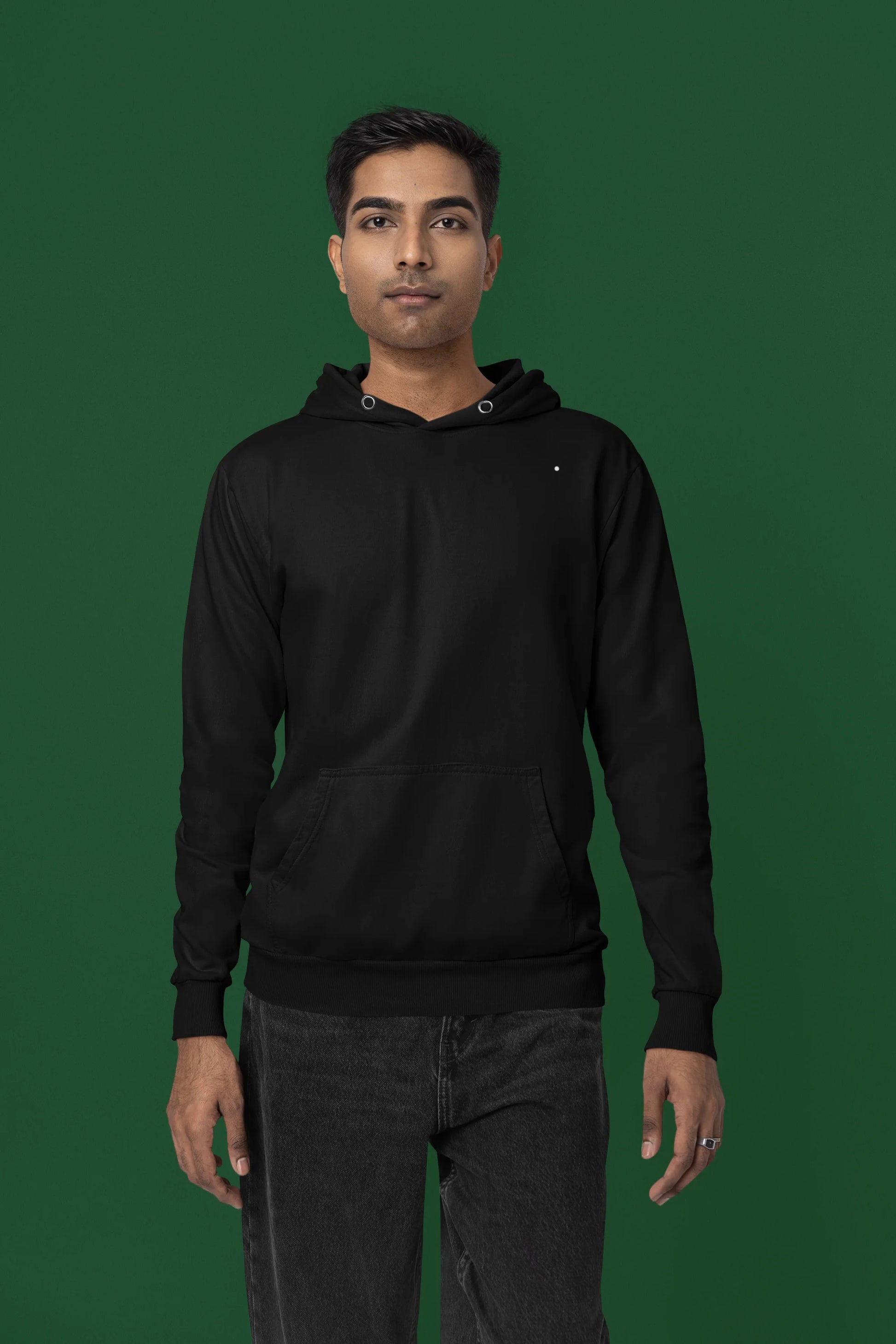 First front view of a male model wearing a black hoodie with a Japanese art style tiger design.