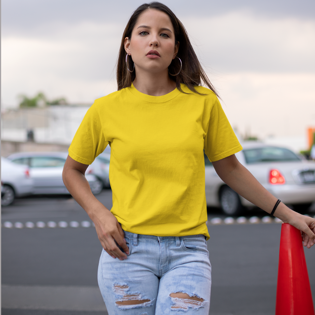 Front view of a female model wearing a yellow oversized, premium quality, pure cotton t-shirt.