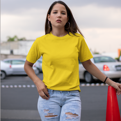 Front view of a female model wearing a yellow oversized, premium quality, pure cotton t-shirt.