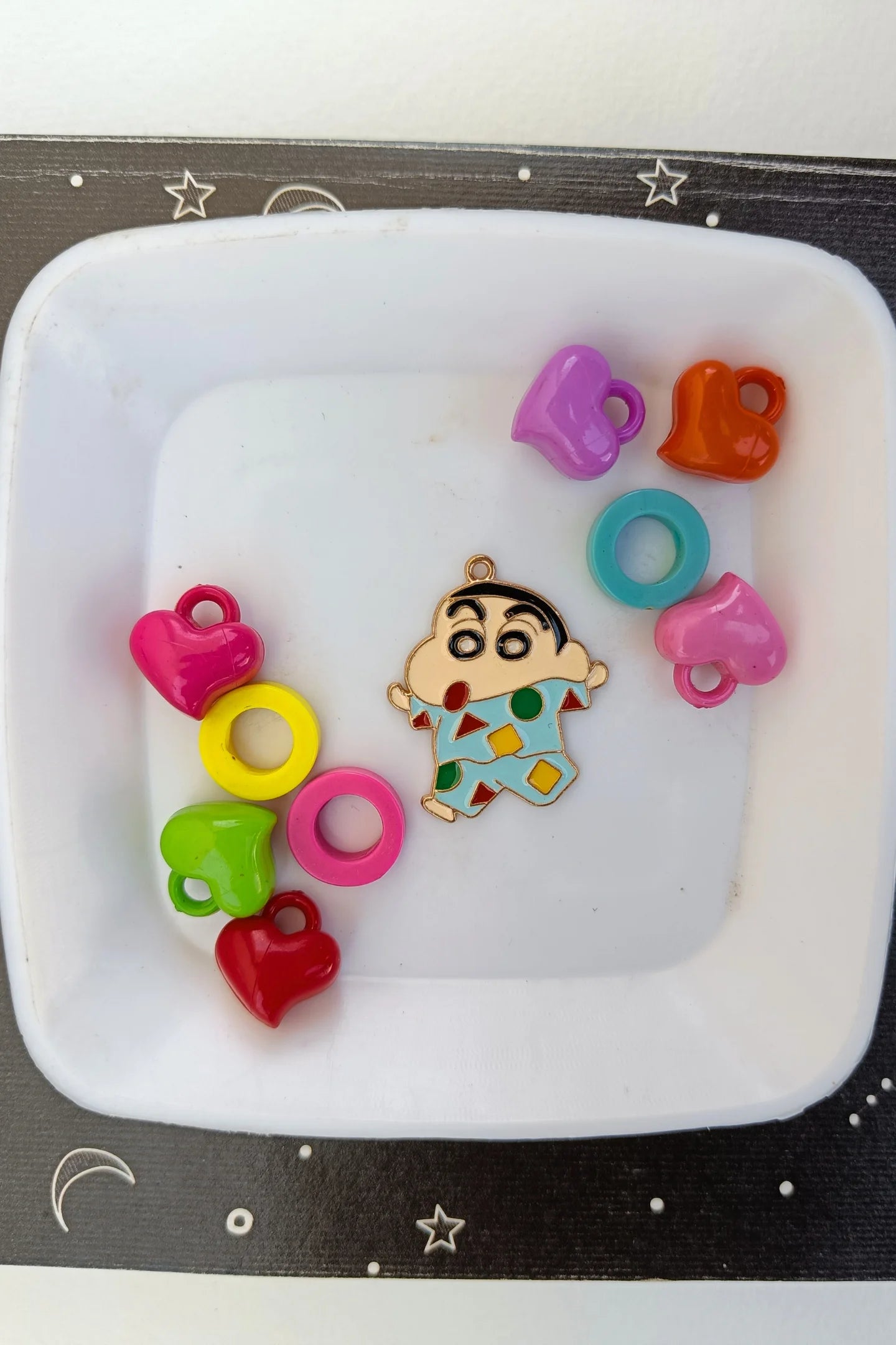 Fourth view of a charm featuring Shinchan waking up in the morning.