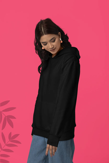 Second front view of a female model wearing a black hoodie with a design of a wolf surveying a Japanese landscape.