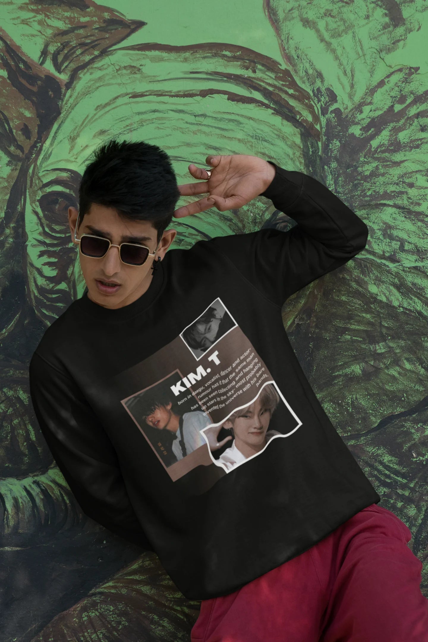 First front view of male model wearing a black sweatshirt featuring a bold design inspired by BTS member Kim Taehyung (V). Ideal for BTS fans (ARMY) and K-Pop enthusiasts.