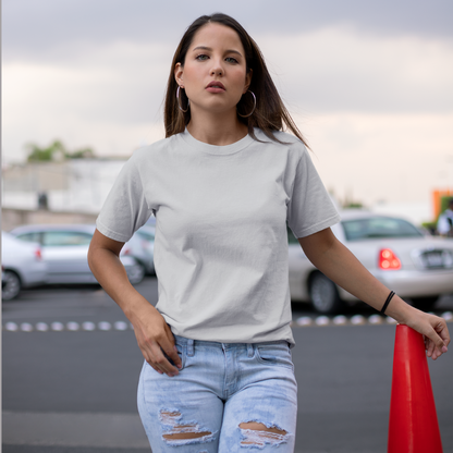 Front view of a female model wearing a grey oversized, premium quality, pure cotton t-shirt.