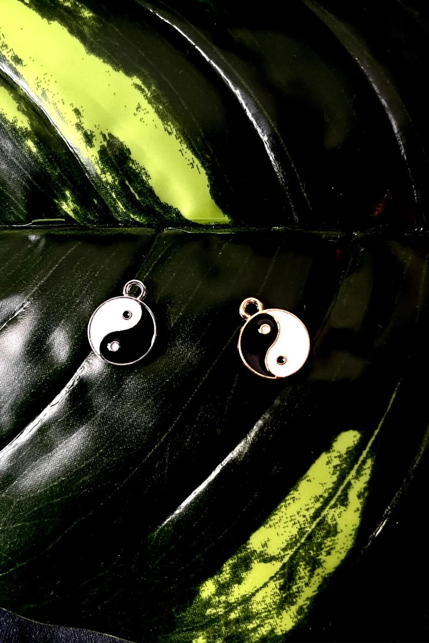 First image of a couples yin and yang charms symbolizing a balanced approach towards eternal love.