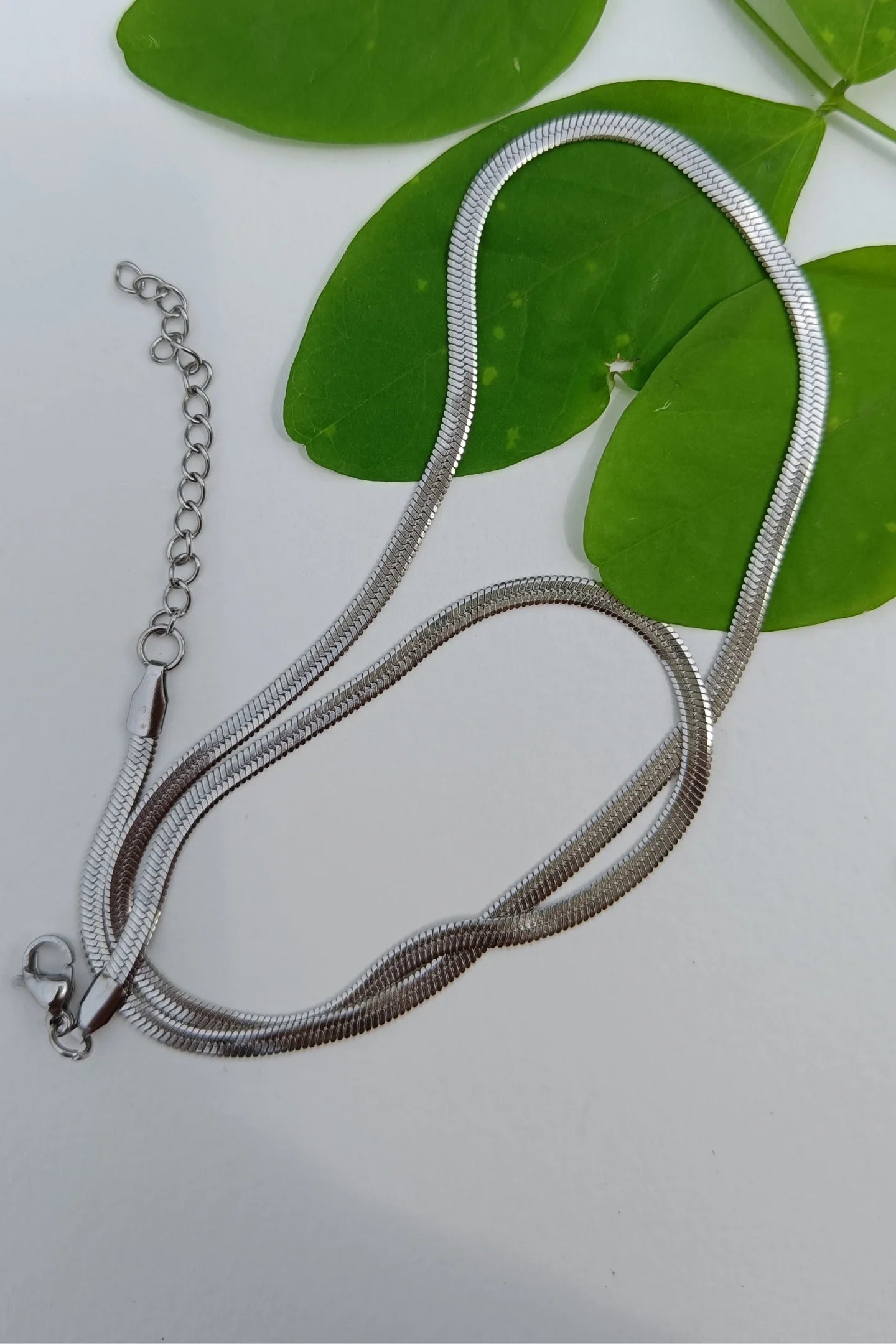 First image of an anti tarnish silver chain necklace featuring a snake like design.