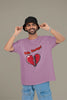 First front view of a male model wearing a dirty purple oversized t-shirt with the text 