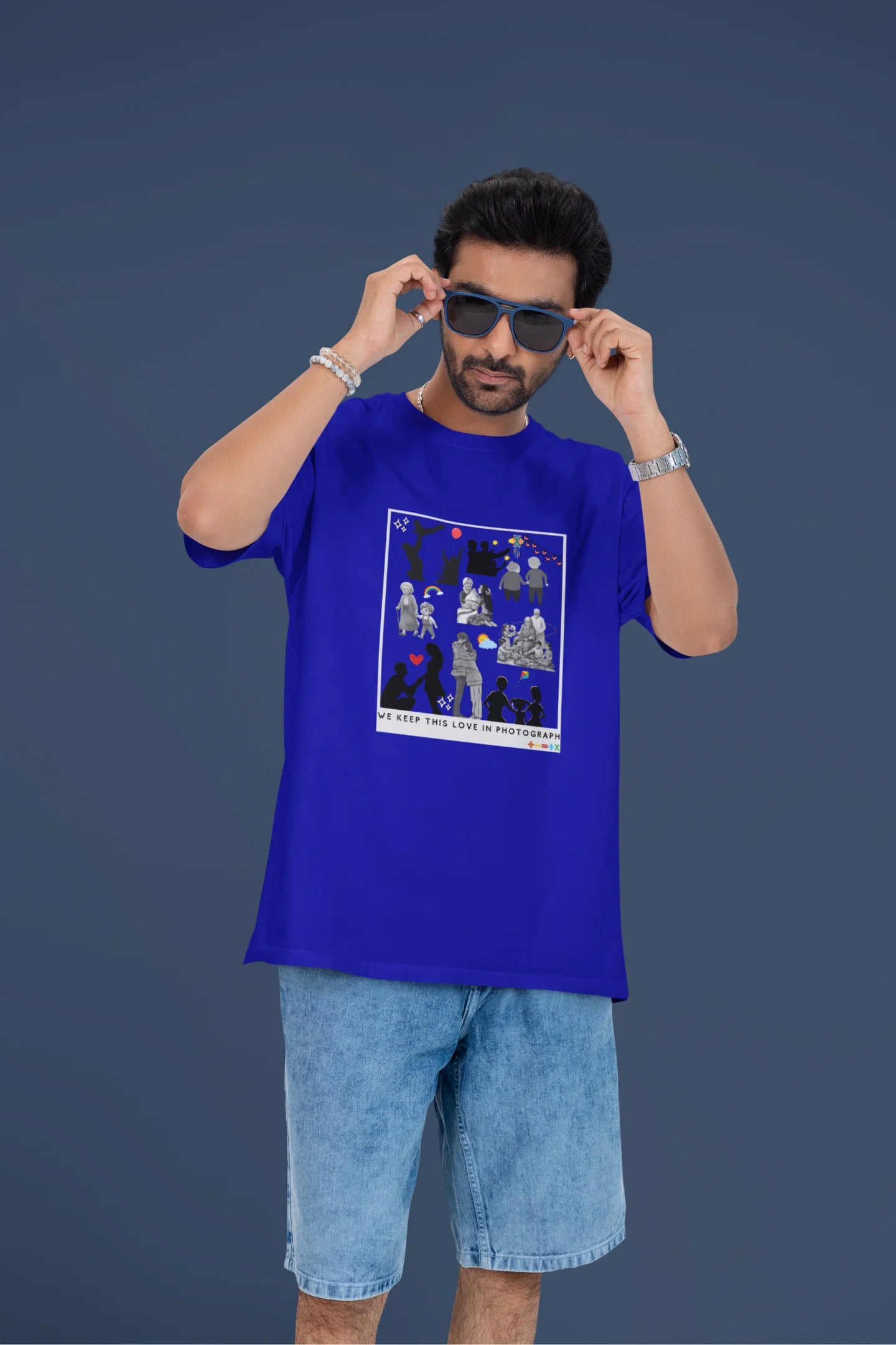 4th front view of a male model wearing a royal blue oversized t-shirt featuring a design that represents cherished memories, inspired by Ed Sheeran's "Photograph."