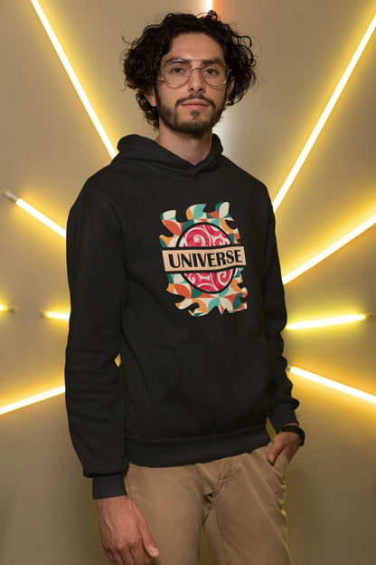 First front view of a male model wearing an black hoodie with a cosmic Universe design inspired by Coldplay.