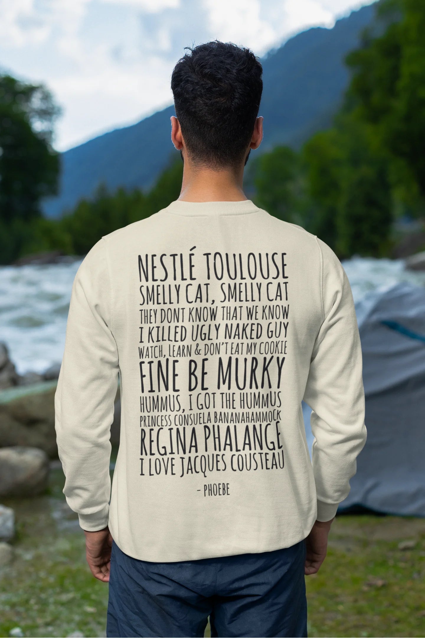 Back view of male model wearing a off-cream F.R.I.E.N.D.S. sweatshirt featuring a fun design inspired by Phoebe Buffay and her iconic quotes.