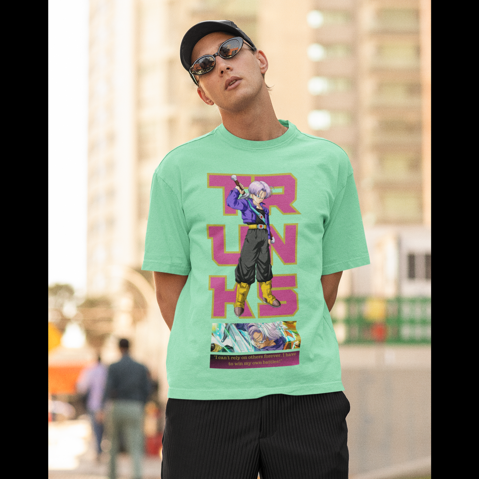 2nd front view of a male model wearing a mint green oversized t-shirt featuring Trunks from Dragon Ball Z with the text "Trunks."