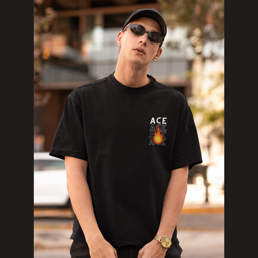 Front view of a male model wearing a black oversized t-shirt featuring Portgas D. Ace with the text "Fire Fist."