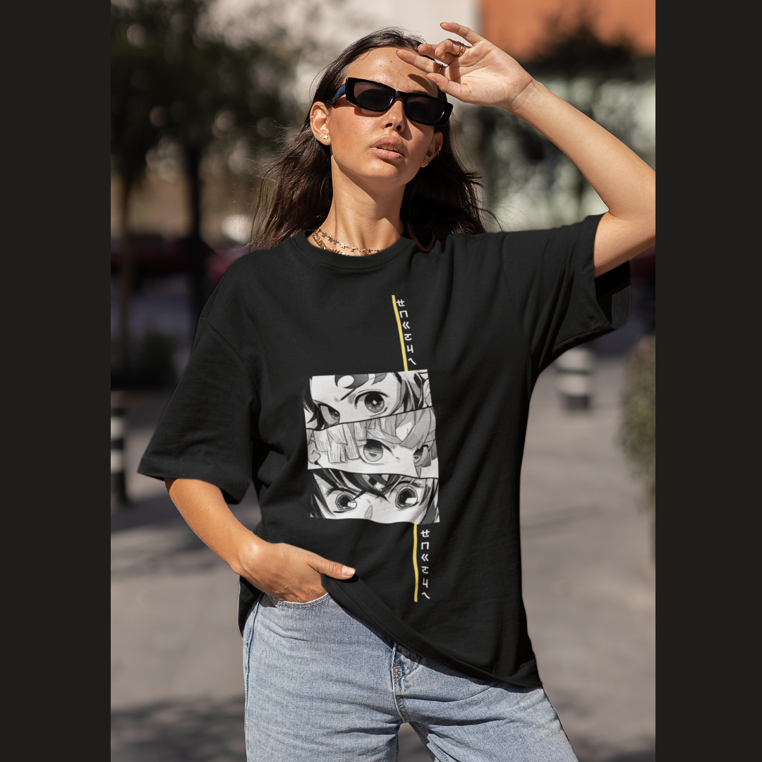 Front view of a female model wearing a black oversized t-shirt featuring Tanjiro Kamado from Demon Slayer: Kimetsu no Yaiba.